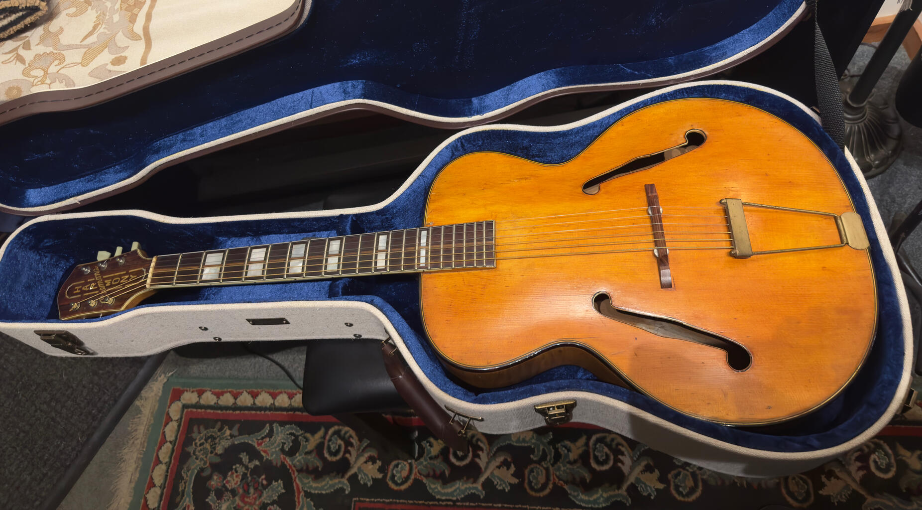 Surfing the Interstates Chapter 10 - Let The Guitar Decide: Vintage golden archtop hollow-body guitar in blue velvet-lined case. Jerry Garcia's blessing transforms this instrument into compass as music guides the hitchhiker's path through 1973 America.